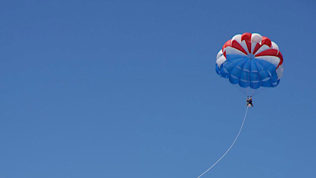 Thumbnail of parasailing on a clear day